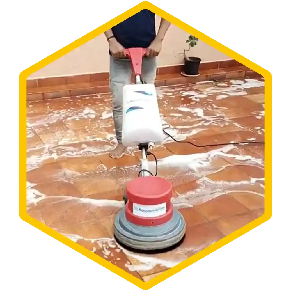 Technician using a steam cleaner on a mattress.